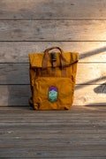 Roll up mustard waterproof backpack Mountains